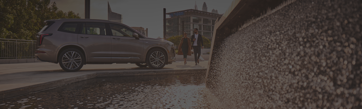 Woman and Man walking towards the vehicle