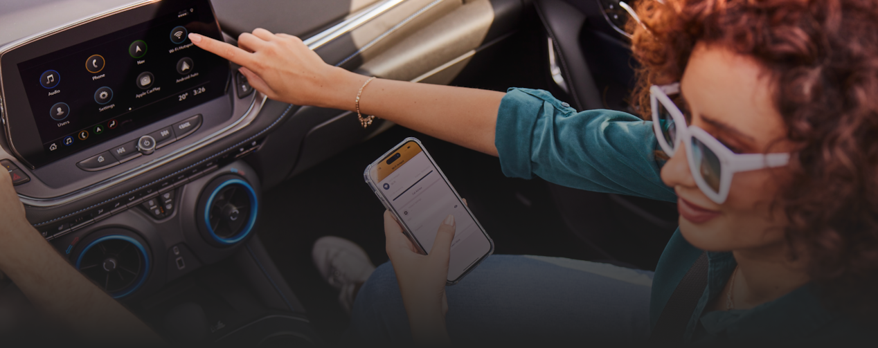 Woman pointing at the car infotainment