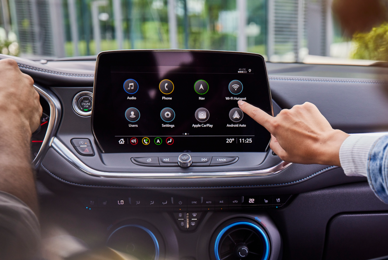 Woman hand working on the car infotainment system