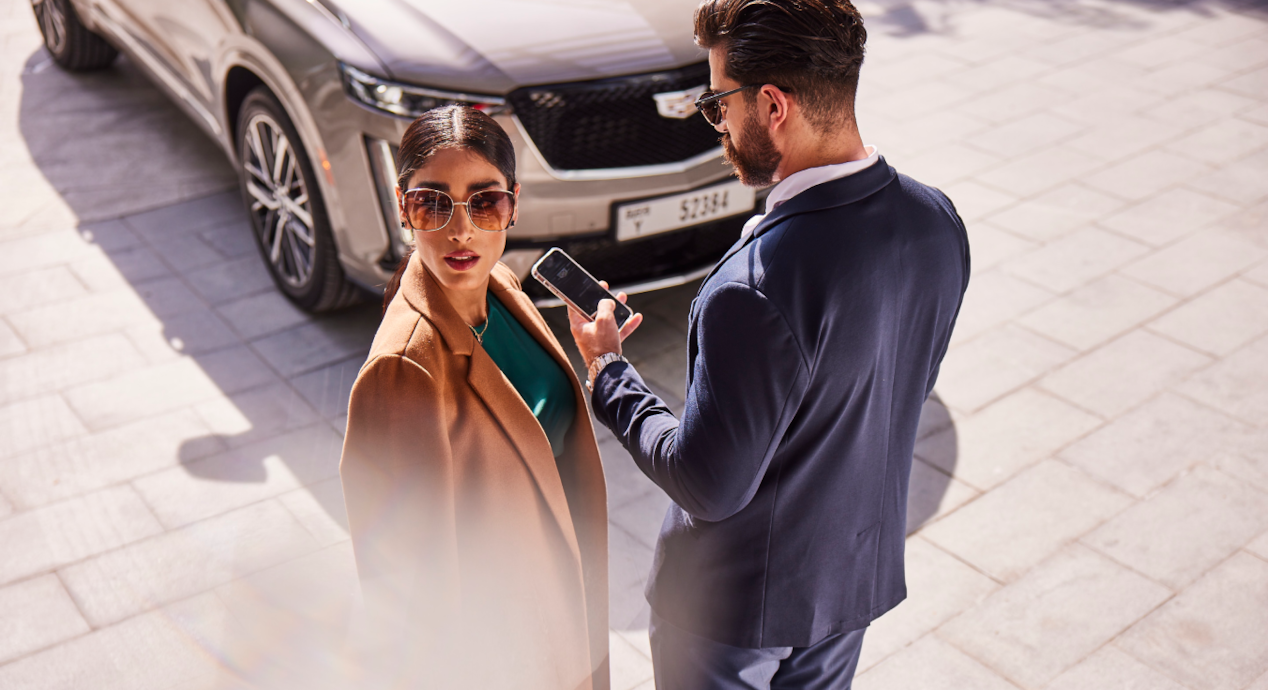 Woman looking away and man looking at the phone