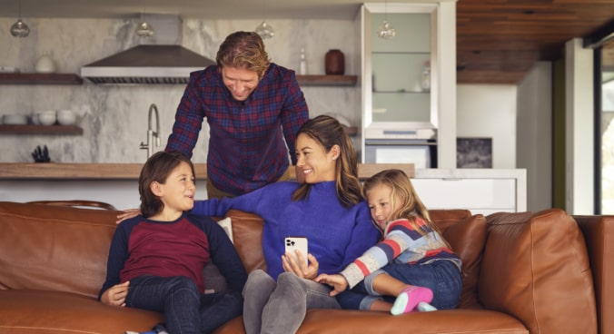 A Family Sitting Together on the Couch 